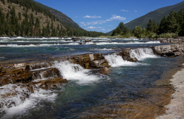 Kootenai falls at the top of the falls with cascading water over the rocks