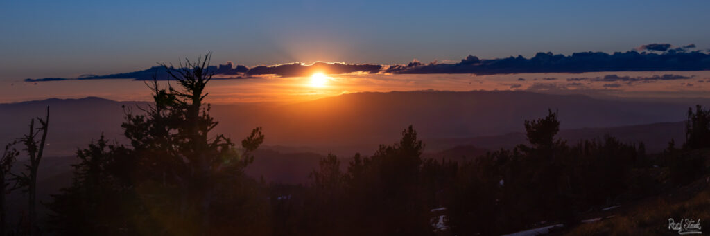 Sunset from 8300 feet elevation with a glowing sun